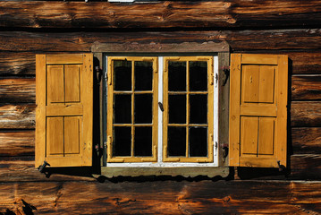Old wooden window with shutters
