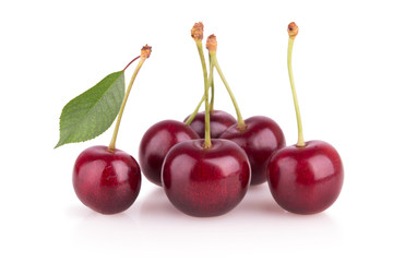 group of ripe cherries on a white background