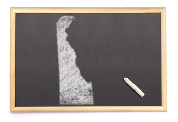Blackboard with a chalk and the shape of Delaware drawn onto. (s