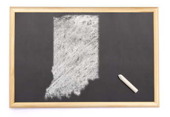 Blackboard with a chalk and the shape of Indiana drawn onto. (se