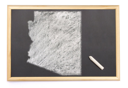 Blackboard with a chalk and the shape of Arizona drawn onto. (se