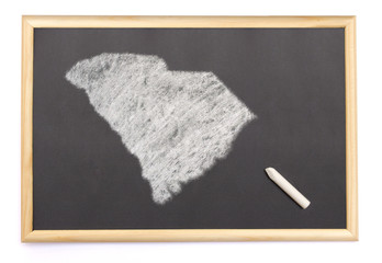 Blackboard with a chalk and the shape of South Carolina drawn on