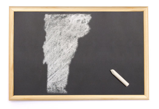Blackboard with a chalk and the shape of Vermont drawn onto. (se