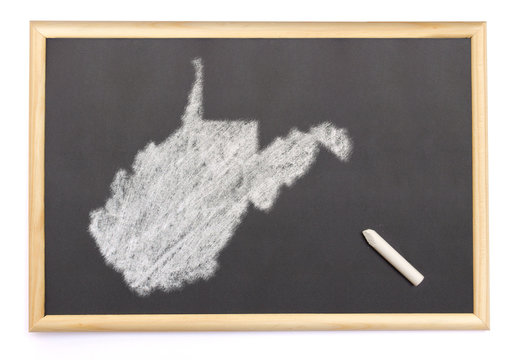 Blackboard with a chalk and the shape of West Virginia drawn ont