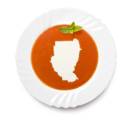 Plate tomato soup with cream in the shape of Sudan.(series)
