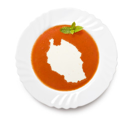 Plate tomato soup with cream in the shape of Tanzania.(series)