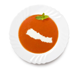 Plate tomato soup with cream in the shape of Nepal.(series)