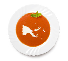 Plate tomato soup with cream in the shape of Papa New Guinea.(se