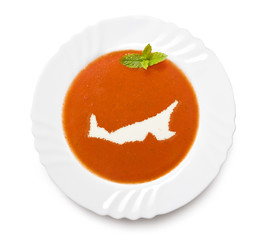 Plate tomato soup with cream in the shape of Prince Edward Islan