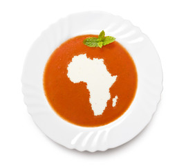 Plate tomato soup with cream in the shape of Africa.(series)
