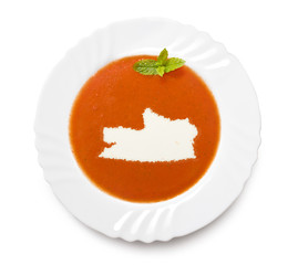 Plate tomato soup with cream in the shape of Russian Federation.