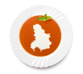 Plate tomato soup with cream in the shape of Serbia Montenegro.(