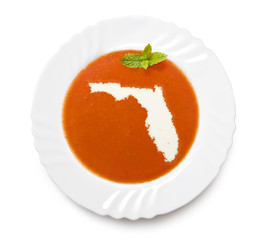 Plate tomato soup with cream in the shape of Florida.(series)