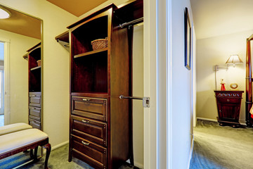 Fototapeta na wymiar Walk-in closet in master bedrooom. View of cabinet