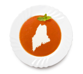 Plate tomato soup with cream in the shape of Maine.(series)