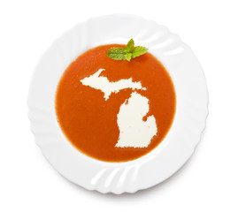 Plate tomato soup with cream in the shape of Michigan.(series)