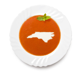 Plate tomato soup with cream in the shape of North Carolina.(ser