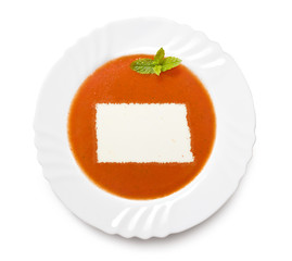 Plate tomato soup with cream in the shape of North Dakota.(serie