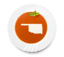 Plate tomato soup with cream in the shape of Oklahoma.(series)