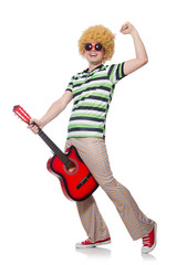 Man with afro wig with guitar on white