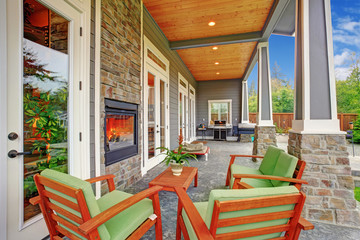Fototapeta na wymiar Cozy backyard with fireplace in luxury house