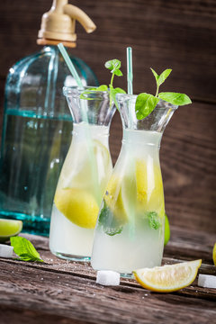 Lemon drink with mint leaf and citrus fruits