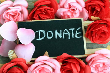 message of donation, with flowers in the background