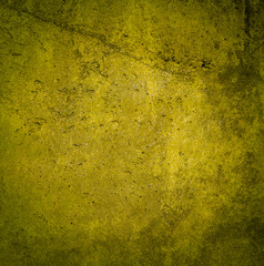 Grunge yellow paint wall background or texture