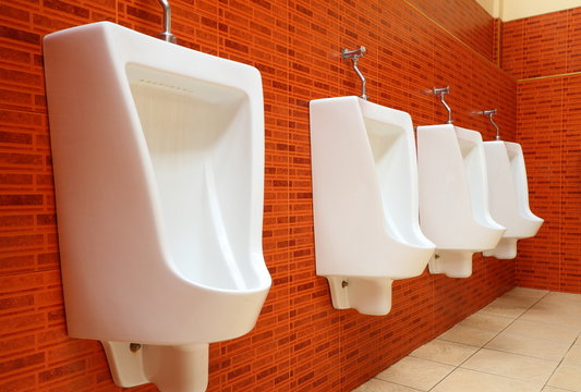 White porcelain urinals in gents toilets