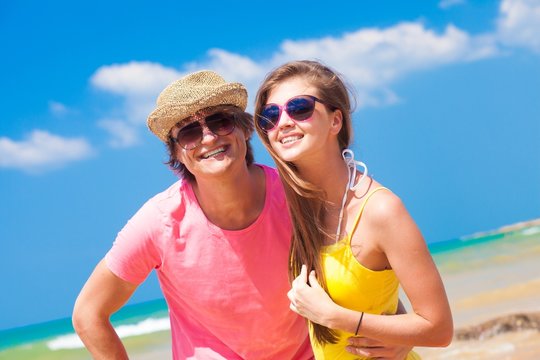 front view of couple having fun at beach