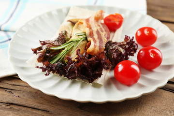 Veggie wrap filled with meat and fresh vegetables