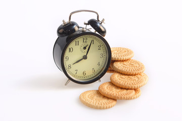 old alarm clock and cookies