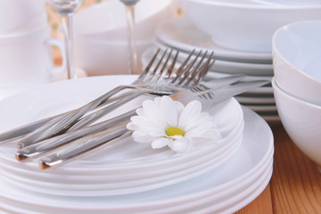 Set of white dishes on table close-up
