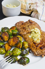 Beef steak with garlic butter and brussel sprouts