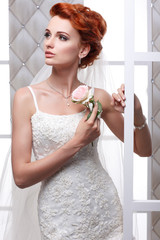 sexual beautiful bride in a wedding-dress is in fashion style