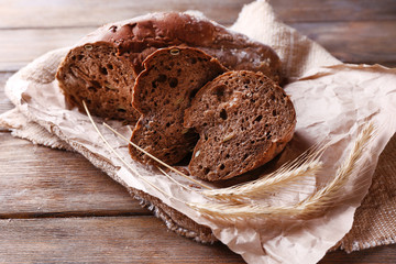 Fresh bread on wooden background