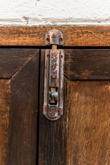metal latch on wooden door