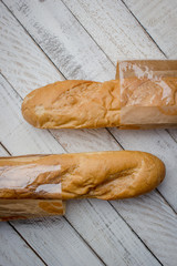 French bread on the wooden background