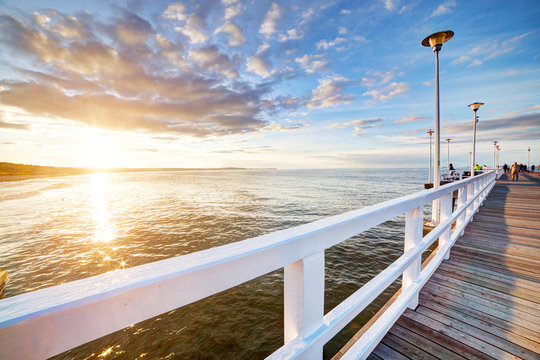 Fototapeta Beautiful retro pier at sunset. Gdansk Brzezno, Poland