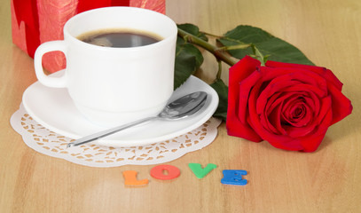 coffee cup and red rose