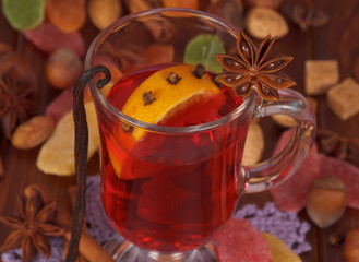 Cup of mulled wine closeup and various spices