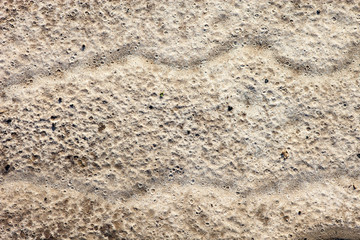 Fototapeta na wymiar Powierzchnia piasku po deszczu