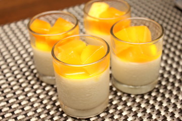 mango mousse with in glass on top