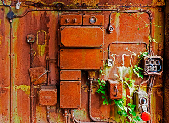 Old electrical panel on iron wall