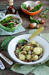 Young boiled potatoes with mushrooms