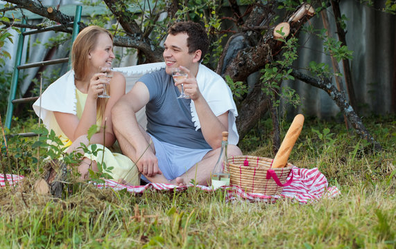 Young couple on picnic in the countryside