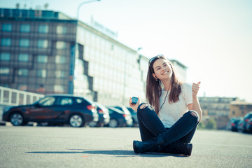 Fototapeta premium young beautiful woman listening music
