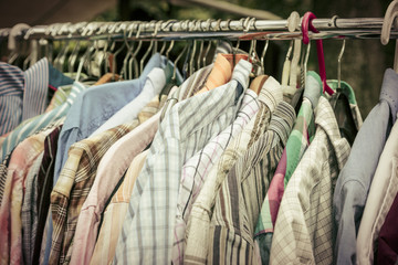clothes on a rack on a flea market