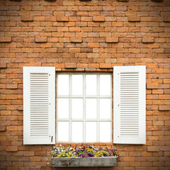 Open Window With Flower Basket On Brick  Wall