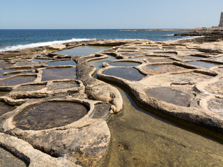 Historic salt pans filled with seawater, Marsaskala, Malta